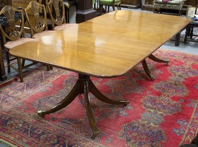 Lot 931 - A mahogany twin-pedestal dining table of...