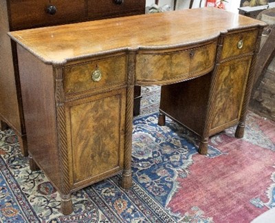 Lot 933 - A Regency mahogany bowfront sideboard, inlaid...