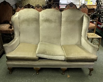 Lot 934 - An upholstered three-chair back settee on...