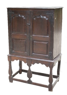 Lot 935 - An 18th Century cupboard with arch top door on...