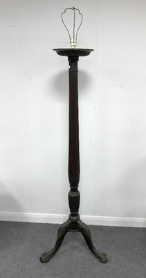 Lot 937 - A mahogany torchere with reeded column on a...