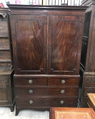 Lot 940 - A Regency mahogany linen press, fitted for...