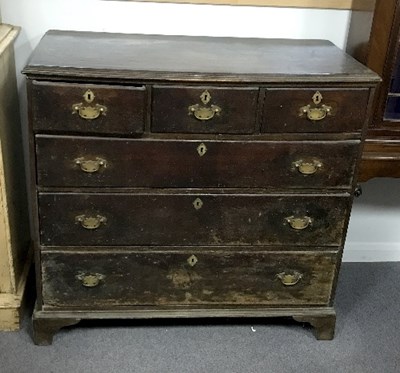 Lot 944 - A George III oak chest of three long and three...