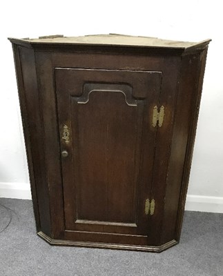 Lot 946 - An early 19th Century oak corner cupboard,...