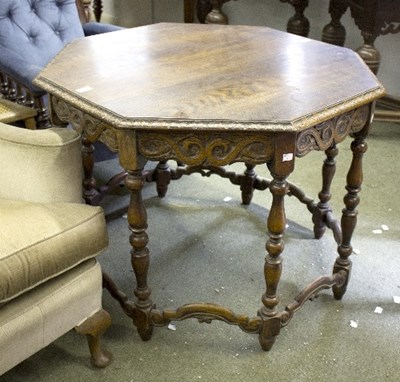 Lot 952 - An oak Continental octagonal centre table with...