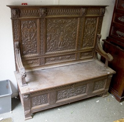 Lot 960 - An early 19th century oak Monk's bench, carved...