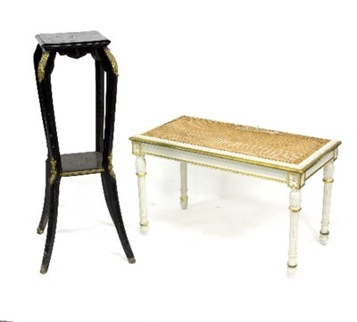 Lot 967 - An ebonised and gilt metal mounted two-tier...