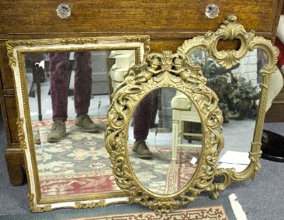 Lot 972 - A rococo style gilt framed mirror, 77cm high...