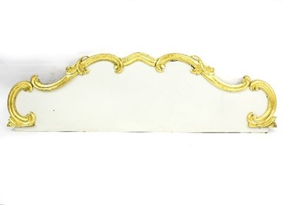 Lot 974 - A painted headboard with gilt scroll border,...