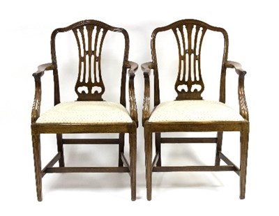 Lot 985 - A pair of George III style open armchairs,...