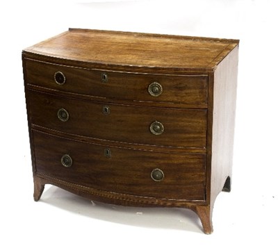 Lot 987 - A Regency mahogany bowfront chest of three...