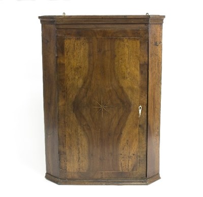 Lot 998 - An 18th Century walnut corner cupboard, the...