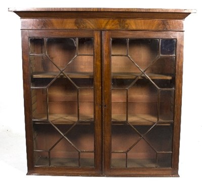 Lot 1010 - A 19th Century mahogany bookcase, enclosed by...