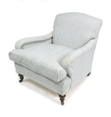 Lot 1011 - A Howard style deep seated armchair, on turned...