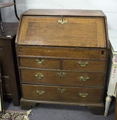 Lot 1019 - A mid 18th Century oak bureau, fitted well...