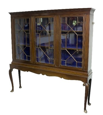 Lot 1023 - A mahogany display cabinet, the dentil cornice...