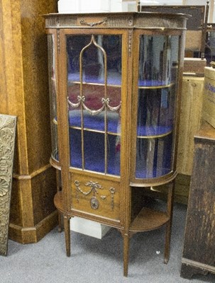 Lot 1025 - An Edwardian bowfront display cabinet, the...