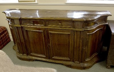 Lot 1034 - A Tuscan walnut breakfront credenza, fitted...