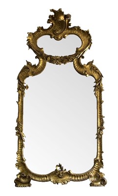 Lot 1038 - A large Italian carved fruitwood mirror, circa...