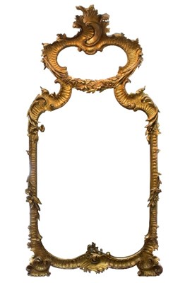 Lot 1039 - A large central Italian carved giltwood mirror...