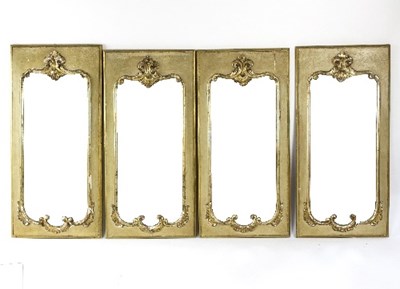 Lot 1049 - A set of four painted and parcel gilt mirrors,...