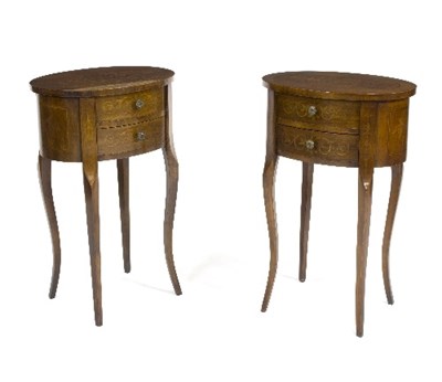 Lot 1064 - A pair of oval inlaid bedside tables, each...