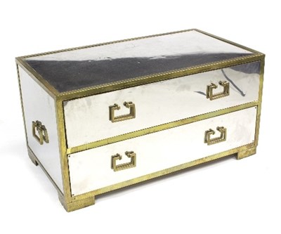 Lot 1065 - A mirrored two-drawer chest with carry handles...