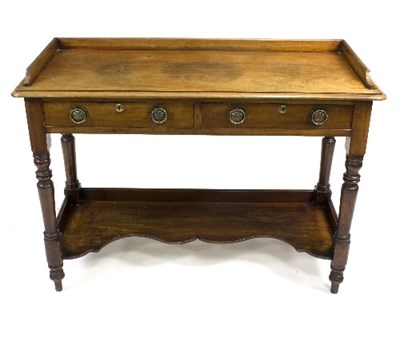 Lot 1069 - A Victorian mahogany two-drawer washstand with...