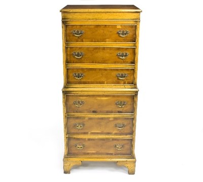 Lot 1071 - A narrow yew wood chest, of six drawers on...