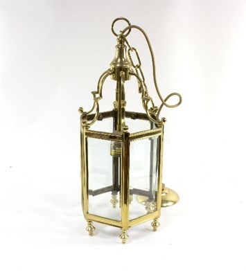 Lot 1074 - A hexagonal brass framed hall lantern with...