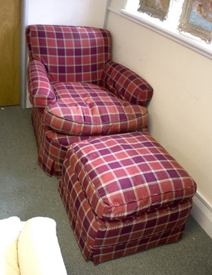 Lot 1089 - An upholstered armchair with check loose cover