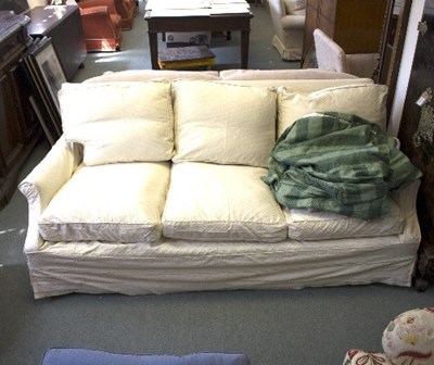 Lot 1090 - A three-seater sofa, with green striped loose...