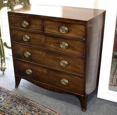 Lot 1098 - A George III mahogany chest of two short over...