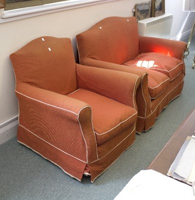 Lot 1100 - A two-seater sofa in orange loose cover and...