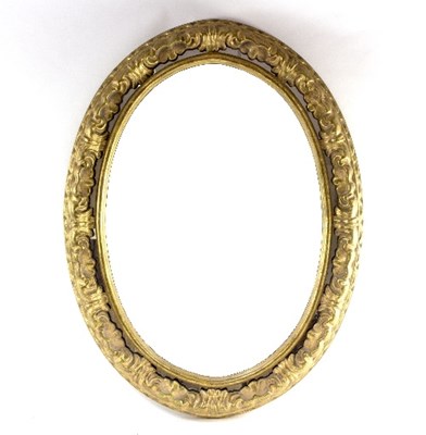 Lot 1105 - An oval gilt framed mirror with moulded border,...