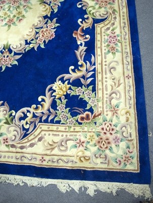 Lot 1126 - A Chinese carpet of blue ground embossed all...