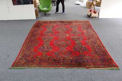 Lot 1129 - A large Turkey rug, the central field with...