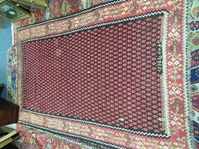 Lot 1135 - A Kelim rug with central field of numerous...