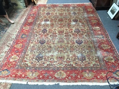 Lot 1136 - An Indian carpet of central cream ground...