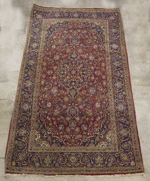 Lot 1138 - An Eastern rug with central blue medallion to...