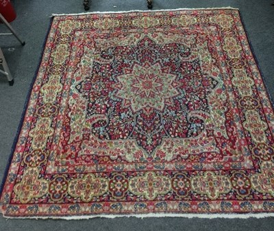 Lot 1142 - A Kirman carpet, 191.5cm x 191cm