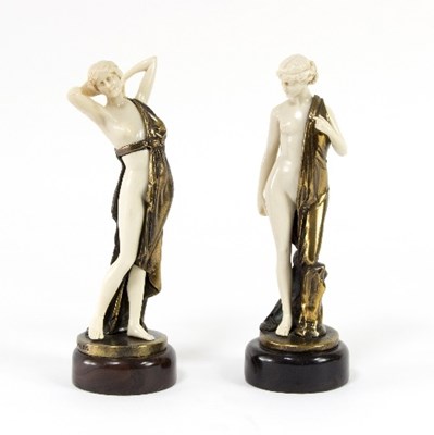 Lot 1153 - A pair of resin and bronzed Art Deco style...