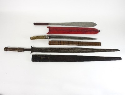 Lot 1174 - An ike short sword with double-edged black...