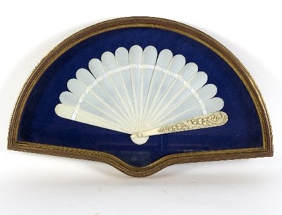 Lot 1216 - A late 19th Century ivory fan of fourteen...