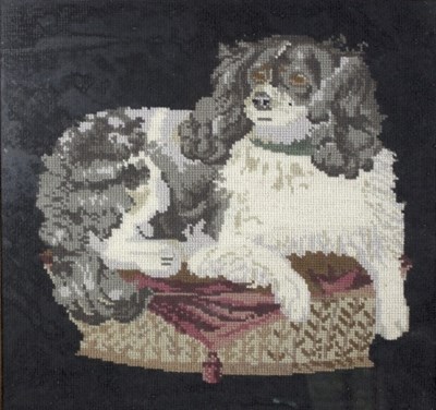 Lot 1228 - A needlework picture of a recumbent spaniel,...