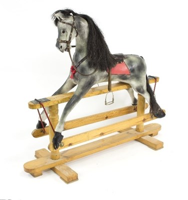 Lot 1237 - A child's painted and decorated rocking horse...