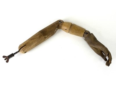 Lot 1246 - A single articulating wooden arm, 83cm long