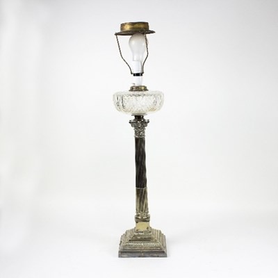 Lot 1271 - A silver plated oil lamp, the Corinthian...