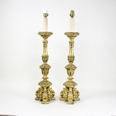 Lot 1273 - A pair of Italian style giltwood table lamps...