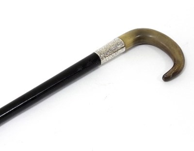 Lot 1280 - An ebonised walking cane with horn handle and...